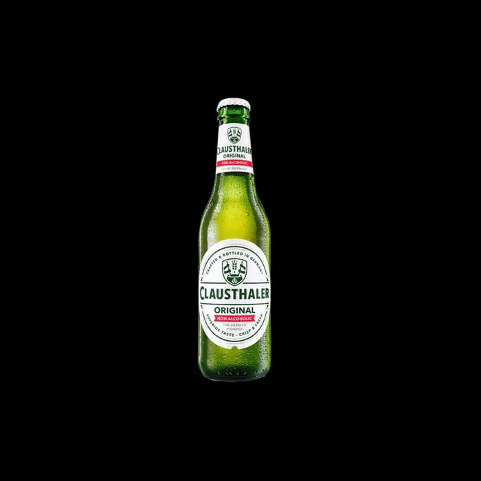 Clausthaler Original non-alcoholic beer showing a bright golden color with a smooth, creamy palate and well-balanced lager taste