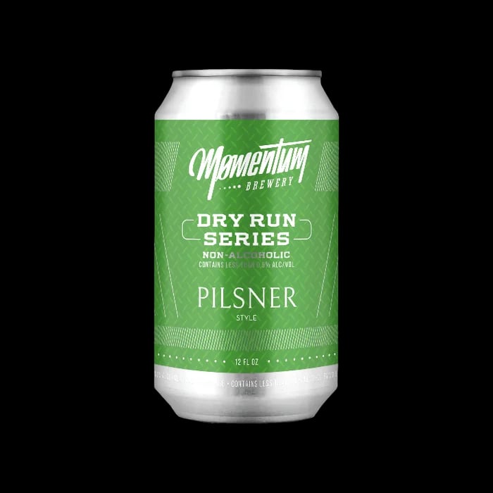 Momentum Brewery's non-alcoholic Pilsner, a refreshing zero-alcohol beer with a straw to golden color.